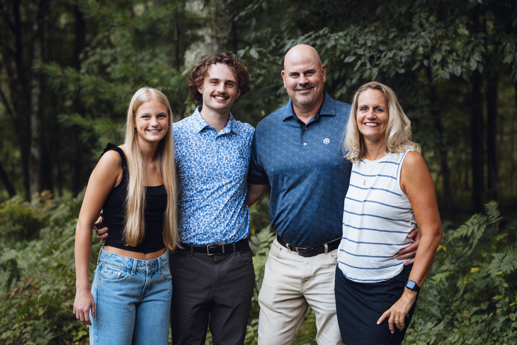 Family portrait in a wooded setting