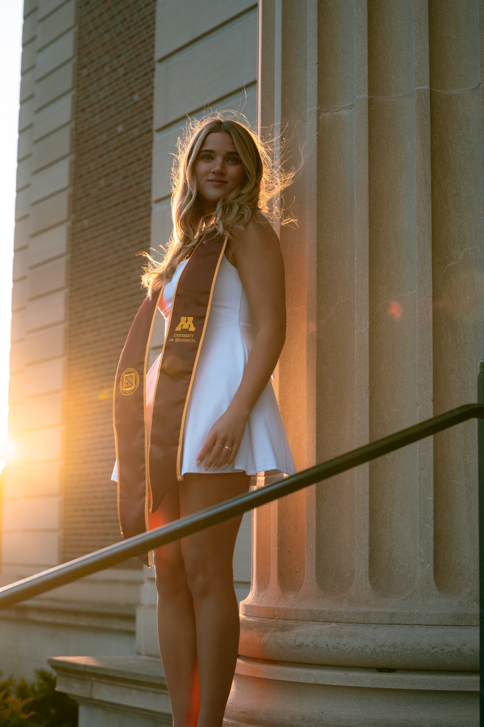 University of Minnesota graduate in warm sunset light