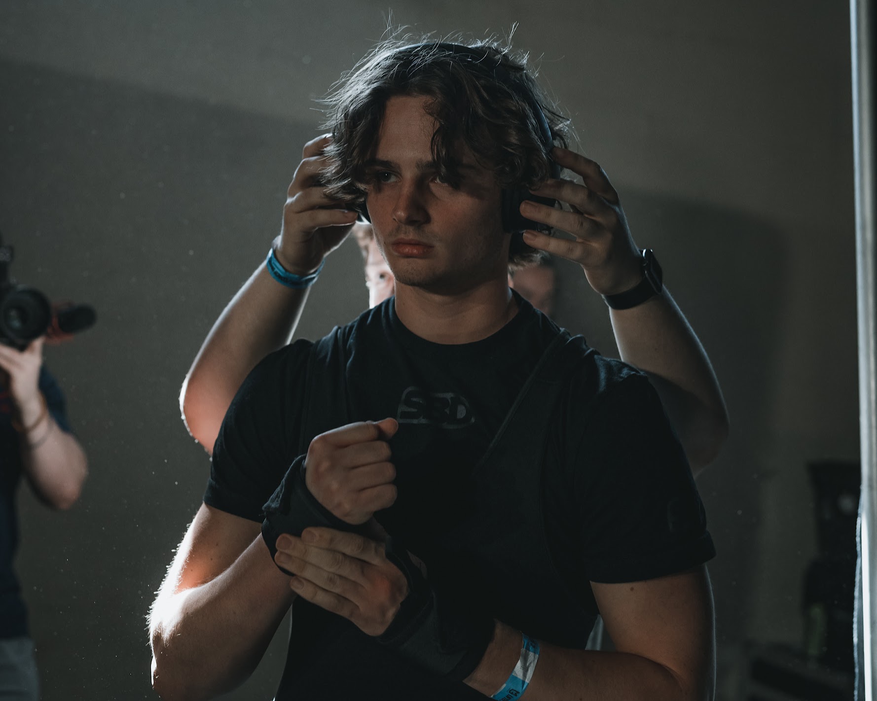 Braden, the photographer behind Lockd Media, preparing to photograph a powerlifting meet